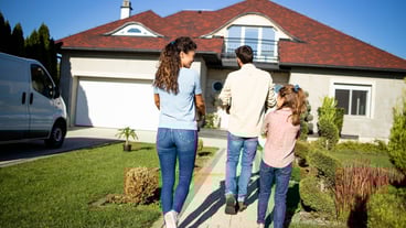 Happy family just bought a new house and moving in.