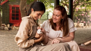 Medium shot smiley women with cute rabbit